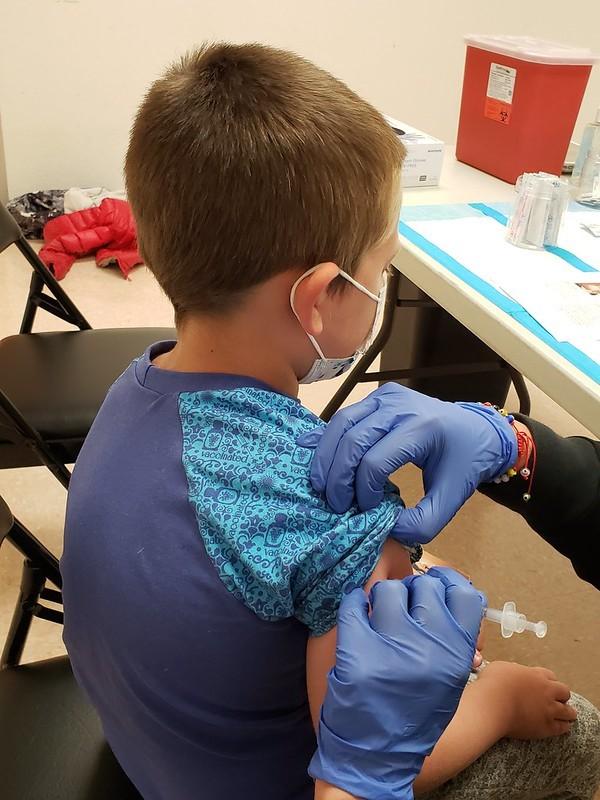 Young boy getting COVID vaccine