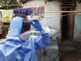 Ebola health worker in full PPE entering home