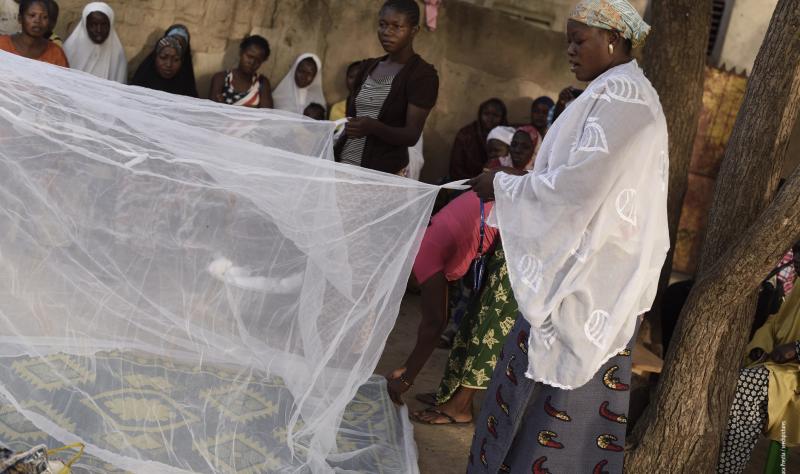 African women with malaria nets