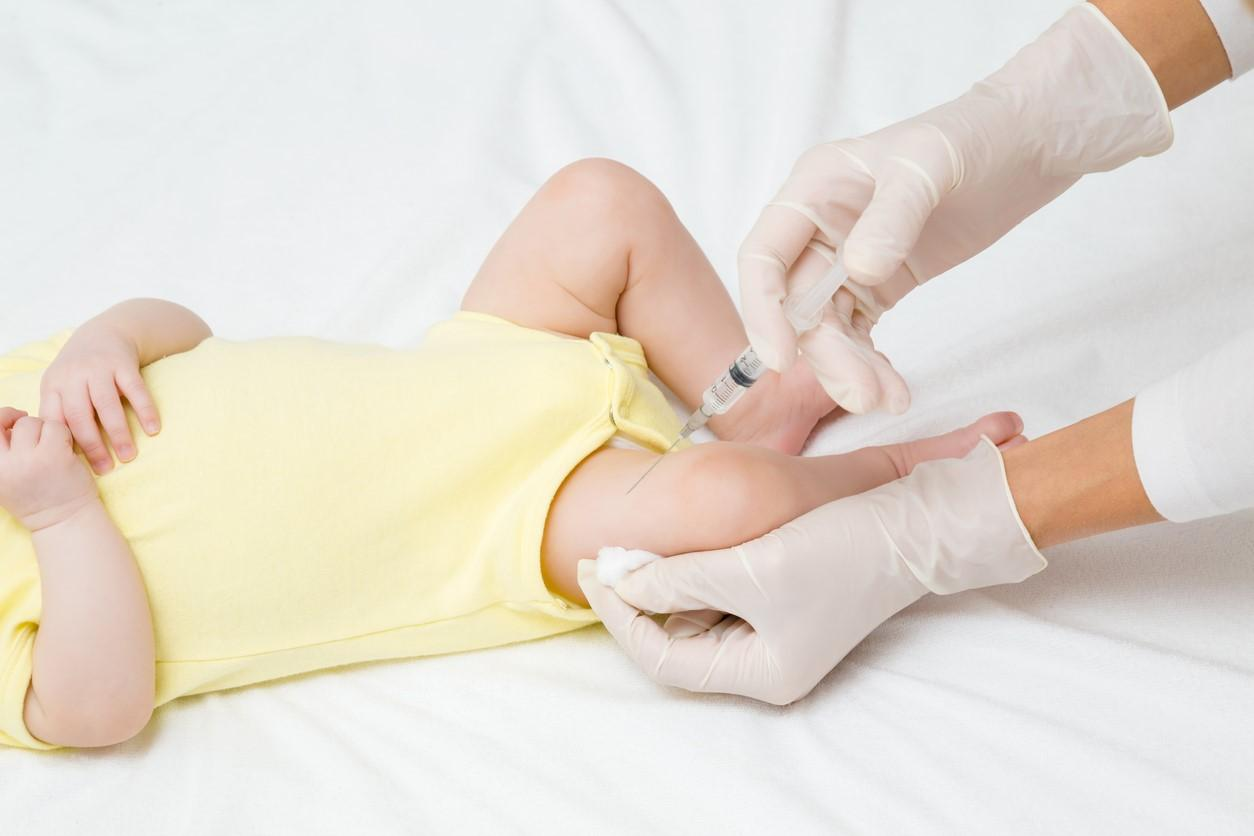 Infant being vaccinated
