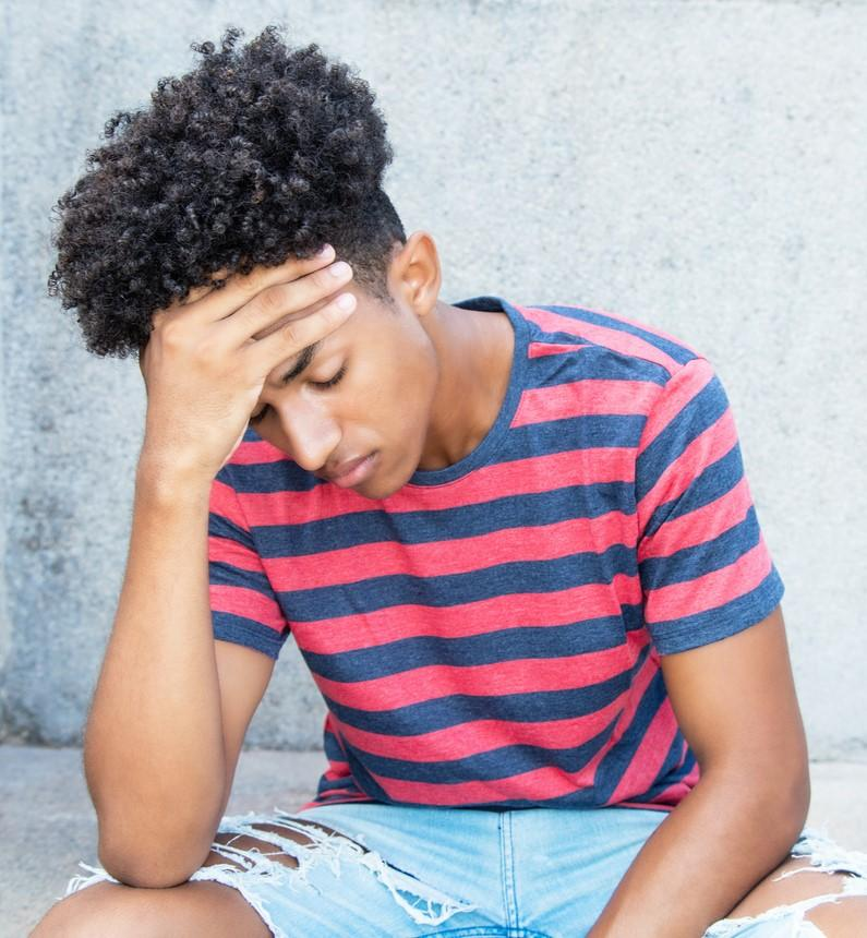 Unhappy teenage boy