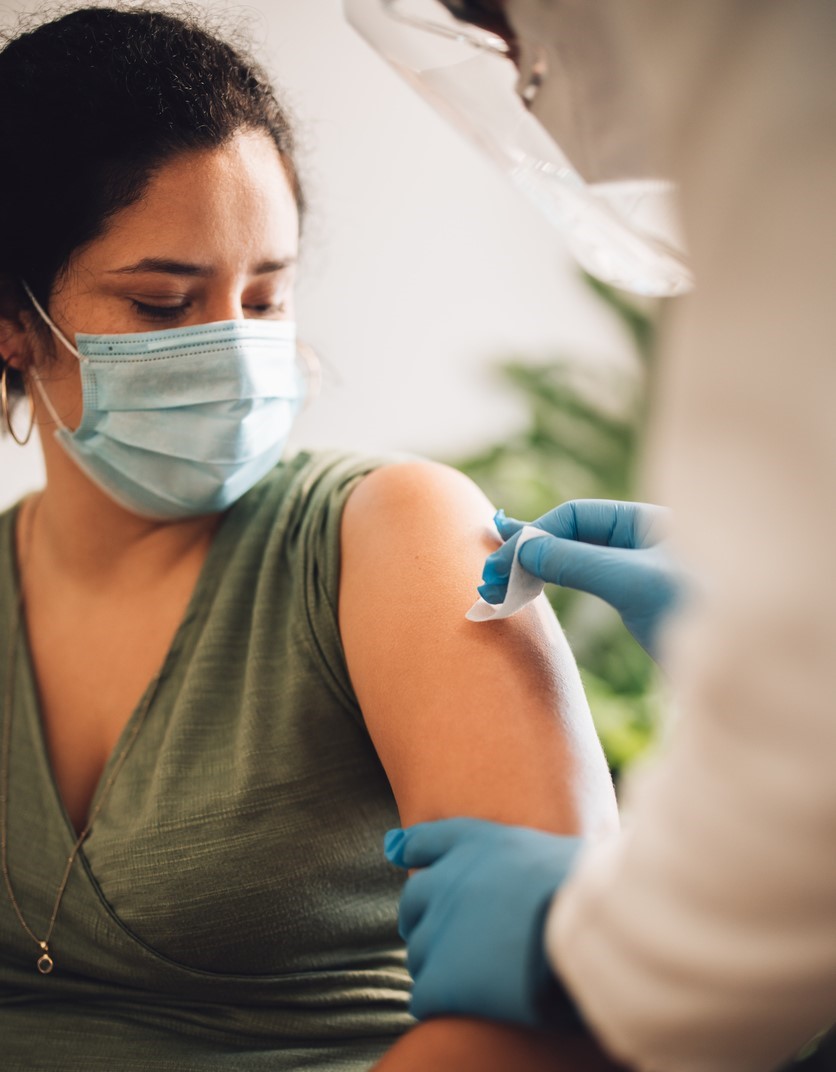 Woman getting prepped for vaccine