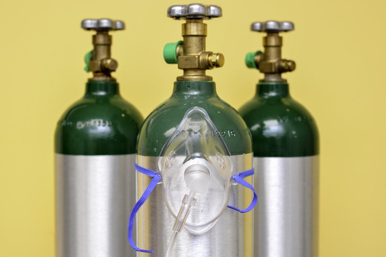 Three medical oxygen tanks