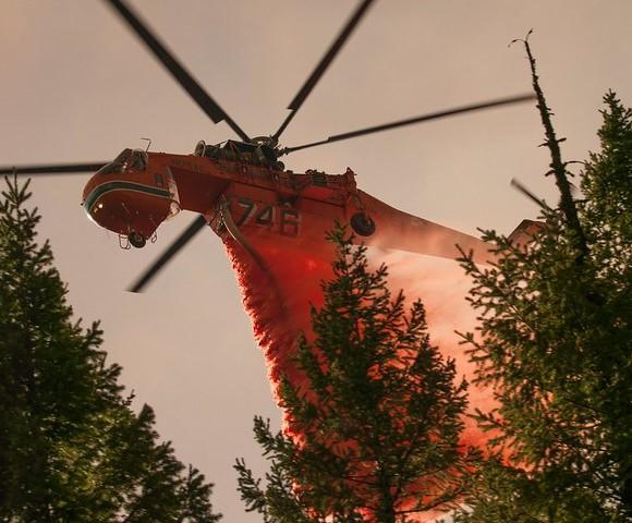 Helicopter fighting forest fire