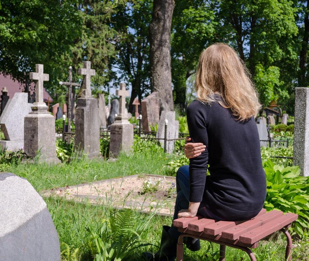 Grieving woman at graveside