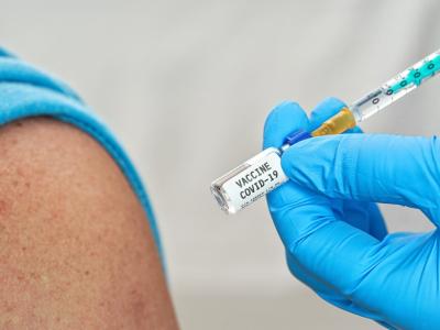 Arm with COVID-19 vaccine