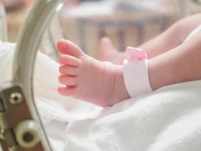 Baby feet in hospital bassinet