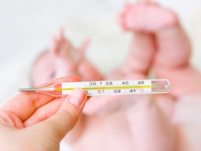 Baby with thermometer