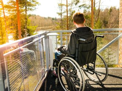Boy in wheelchair on balcony