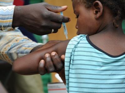 Child gets vaccine in Africa