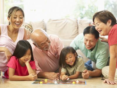 Extended family playing board game