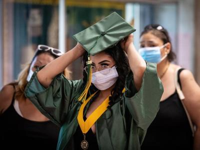 College graduate with mask