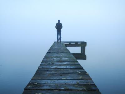 Lone person at end of dock