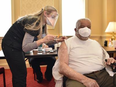 Older man getting COVID vaccine