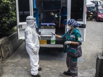 Paramedic getting sanitizer sprayed