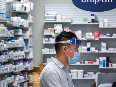 Pharmacist with mask and visor