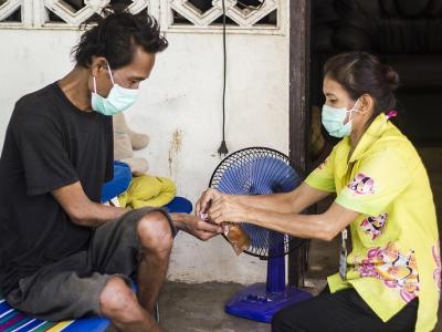 Man receiving tuberculosis drugs