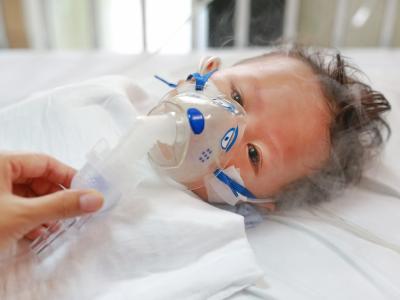 Sick baby on nebulizer