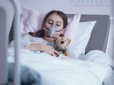 Sick girl on oxygen in hospital