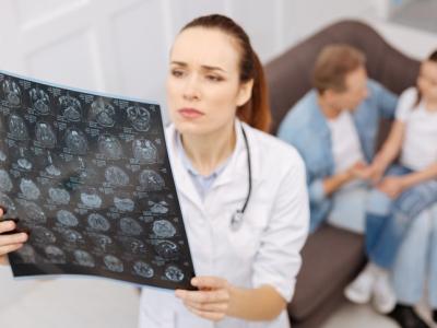 Doctor studying MRI brain scans