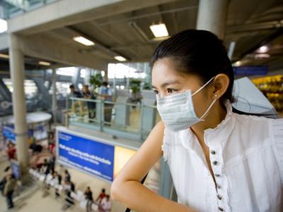 Woman wearing mask at airport