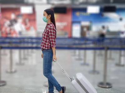 Woman with luggage in airport