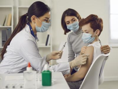 Young teen getting vaccinated