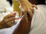 Man receiving pneumococcal vaccine