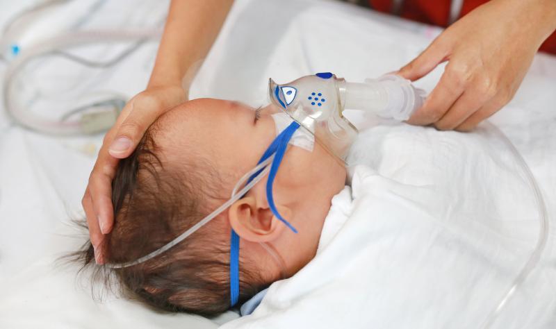 baby using nebulizer
