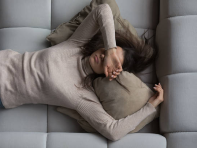 Tired woman on couch