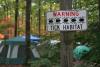 A sign warns campers of the risk of tick bites.
